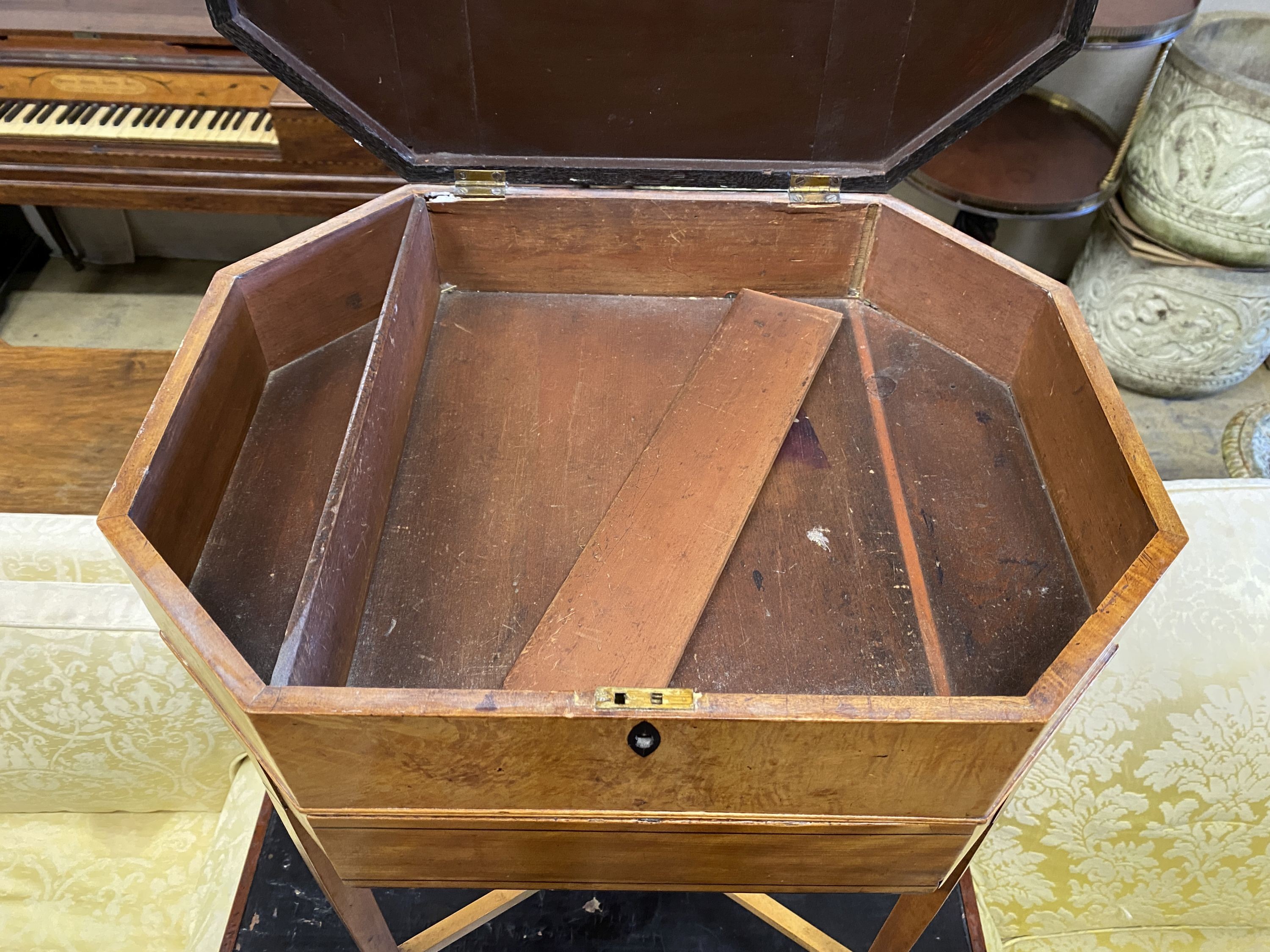 A Georgian design banded satinwood octagonal sewing table, width 49cm, depth 36cm, height 77cm